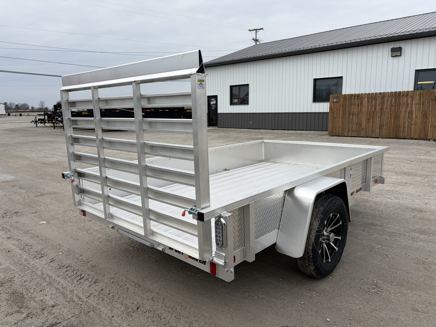 New 2026 Sport Haven AUT610DS (6' x 10') 2.9K Utility Trailer w/ ATP Sides
