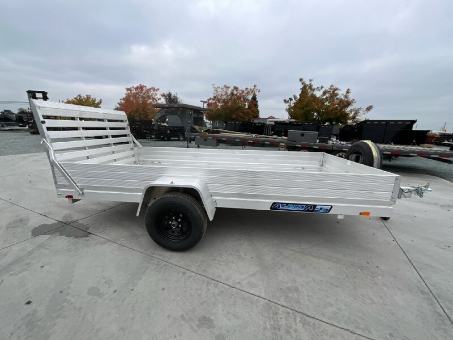 New 2025 Aluma 6812H-ESA-S-TG 5.5FT X 12FT 2990 GVW Utility Trailer