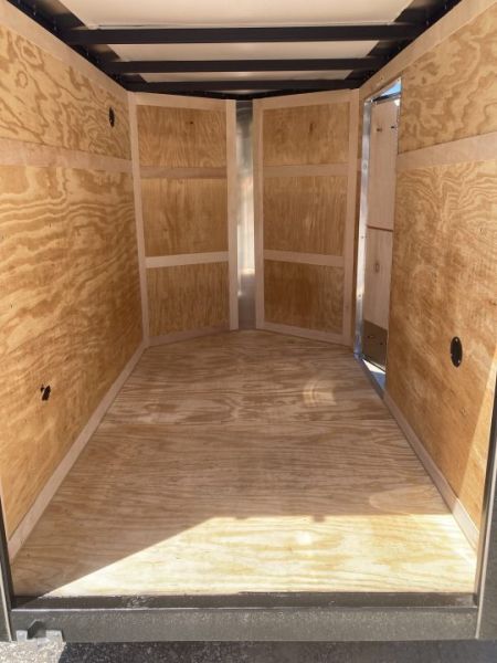 New 2026 Homesteader Trailer / Intrepid Series / 5x8 / 5'6" Interior Height / Single Swing Rear Door / 32" Side Door / 24" Stoneguard / .030 Black Aluminum