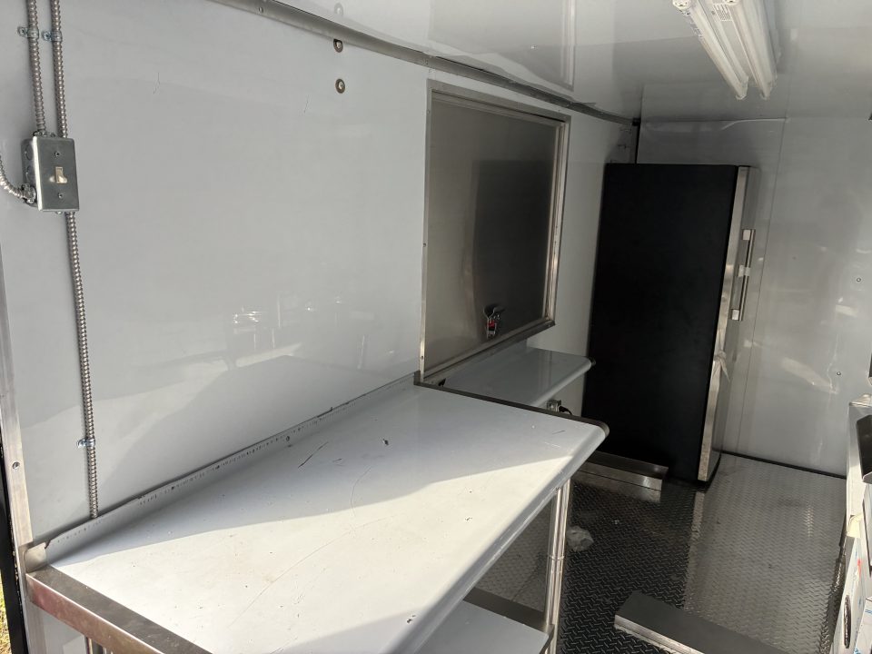 Used 2025 Cargo United LLC Food Truck 7 x 12 Dual Axle White with Blackout Package and Rear Wing with LED Lights Trailer Concession