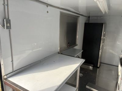 Used 2025 Cargo United LLC Food Truck 7 x 12 Dual Axle White with Blackout Package and Rear Wing with LED Lights Trailer Concession