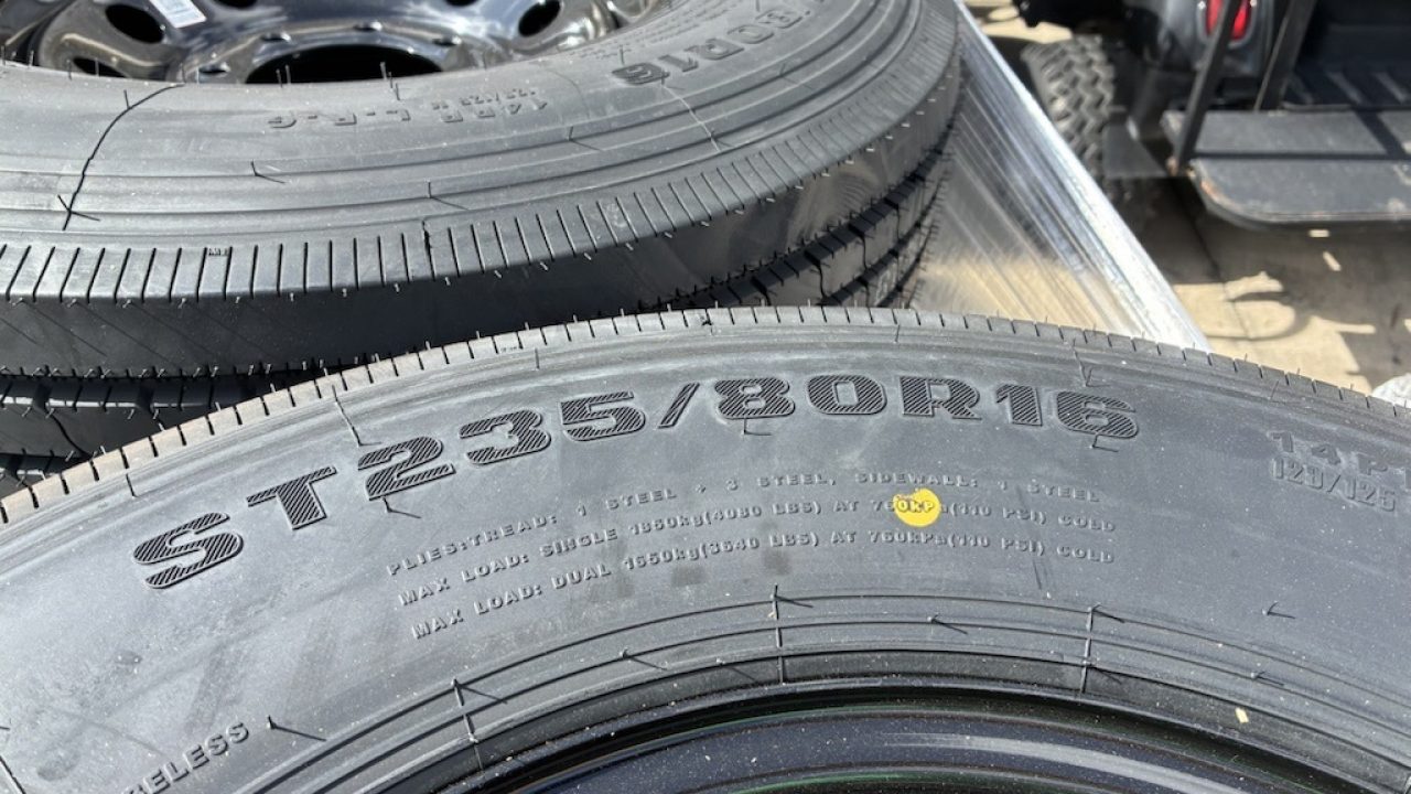 New RAINIER ST235/80R106G 14 PLY WITH BLACK WHEEL