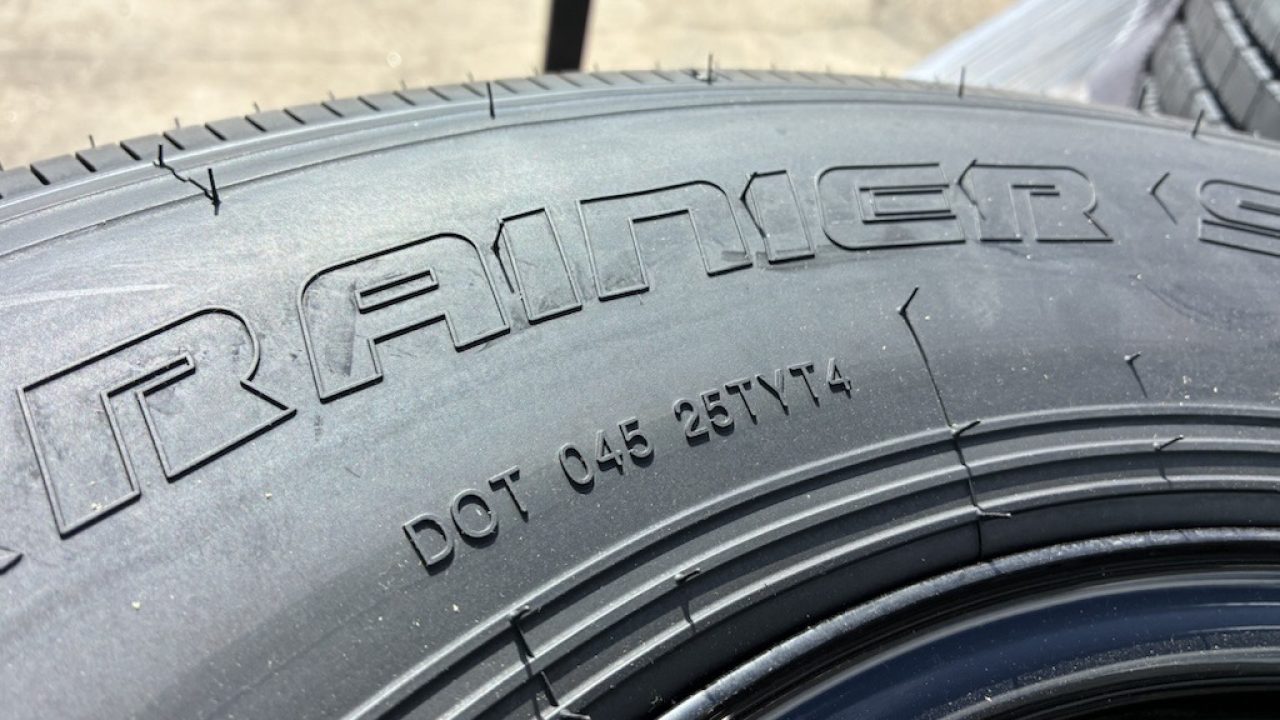 New RAINIER ST235/80R106G 14 PLY WITH BLACK WHEEL
