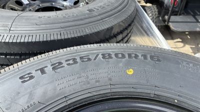New RAINIER ST235/80R106G 14 PLY WITH BLACK WHEEL