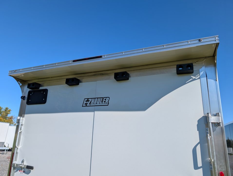 New 2027 E-Z Hauler EZEC8.5X24CH-XLT-P Car Hauler 7 FOOT 1 INCH INTERIOR HEIGHT 080 POLYCORE, TRANSLUCENT ROOF, CANOPY, TORSION AXLES, FREE ALUMINUM WHEEL UPGRADE