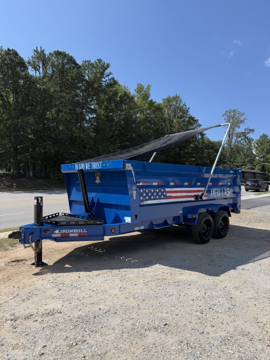 New 2027 Iron Bull DWB8316082 America 250 Series Dump Trailer /Hyd Jack / Wireless Remote / Solar Panel / 48" High Sides / 2-8k Electric Brake Axles / Tarp / Alum Ramps / Combo Gate / Powder Coat Blue