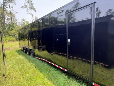 New 2027 Rock Solid Cargo 8.5x36 Triple Axle Enclosed Car Hauler For Sale – Black Polycore | Blackout Package