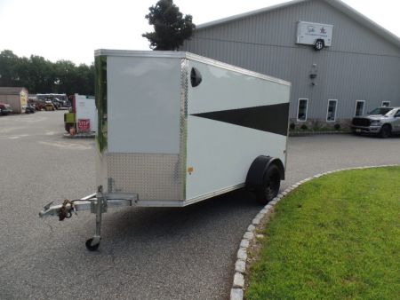 Used 2025 ALCOM 5' by 10 ft. , with 2,990 lb. GVWR, 67" interior height Cargo / Enclosed Trailer