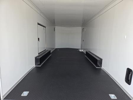 New 2027 Rock Solid 8.5X24 TANDEM 10K CARGO W/SPREAD AXLE DRIVERS SIDE ESCAPE OVER FENDER 7' HEIGHT BLACKOUT TRIM RUBBER NICKEL FLOORING