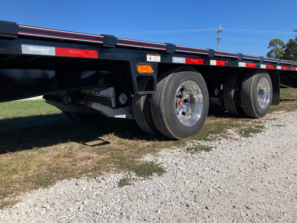 New 2027 Diamond C Trailers 102x40 TANDEM 40K GN W/ MAX RAMPS, 72" SPREAD, AIR RIDE & HYDROJACKS Flatbed Trailer
