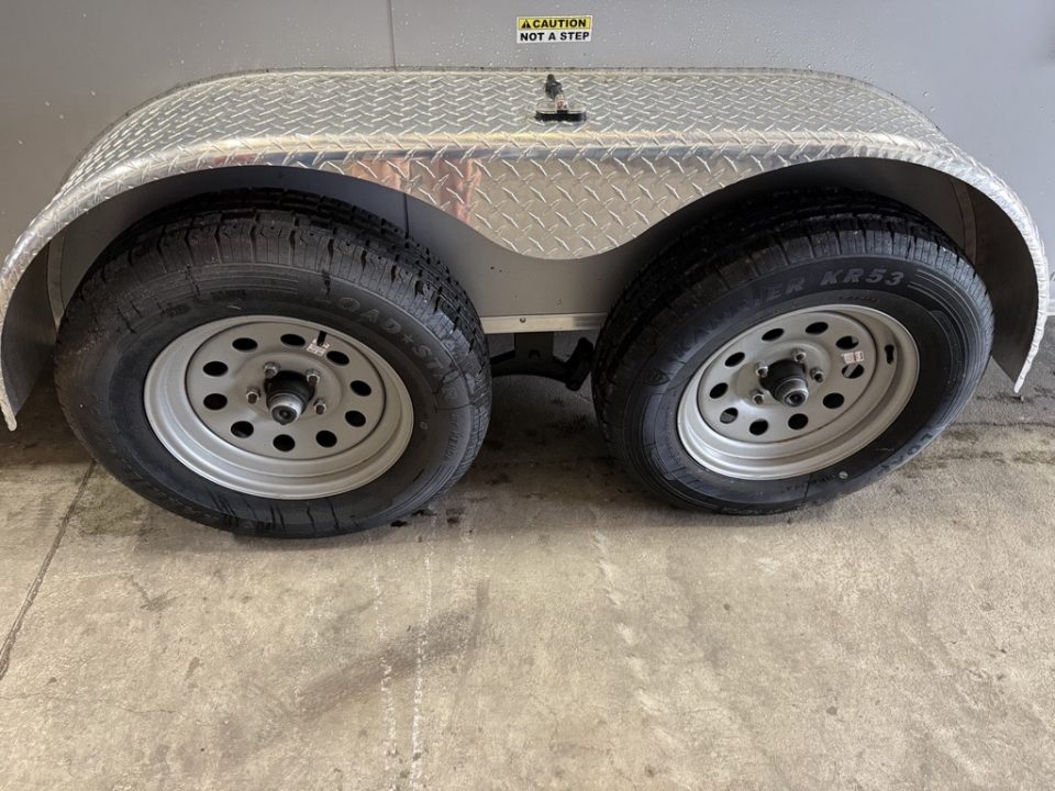 Used 2025 Cynergy Cargo 7X12 Silver Enclosed Cargo Trailer Tandem Axle with 7000 Capacity Cargo / Enclosed Trailer