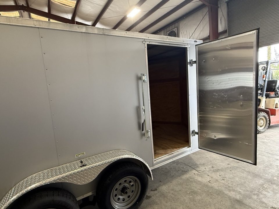 Used 2025 Cynergy Cargo 7X12 Silver Enclosed Cargo Trailer Tandem Axle with 7000 Capacity Cargo / Enclosed Trailer