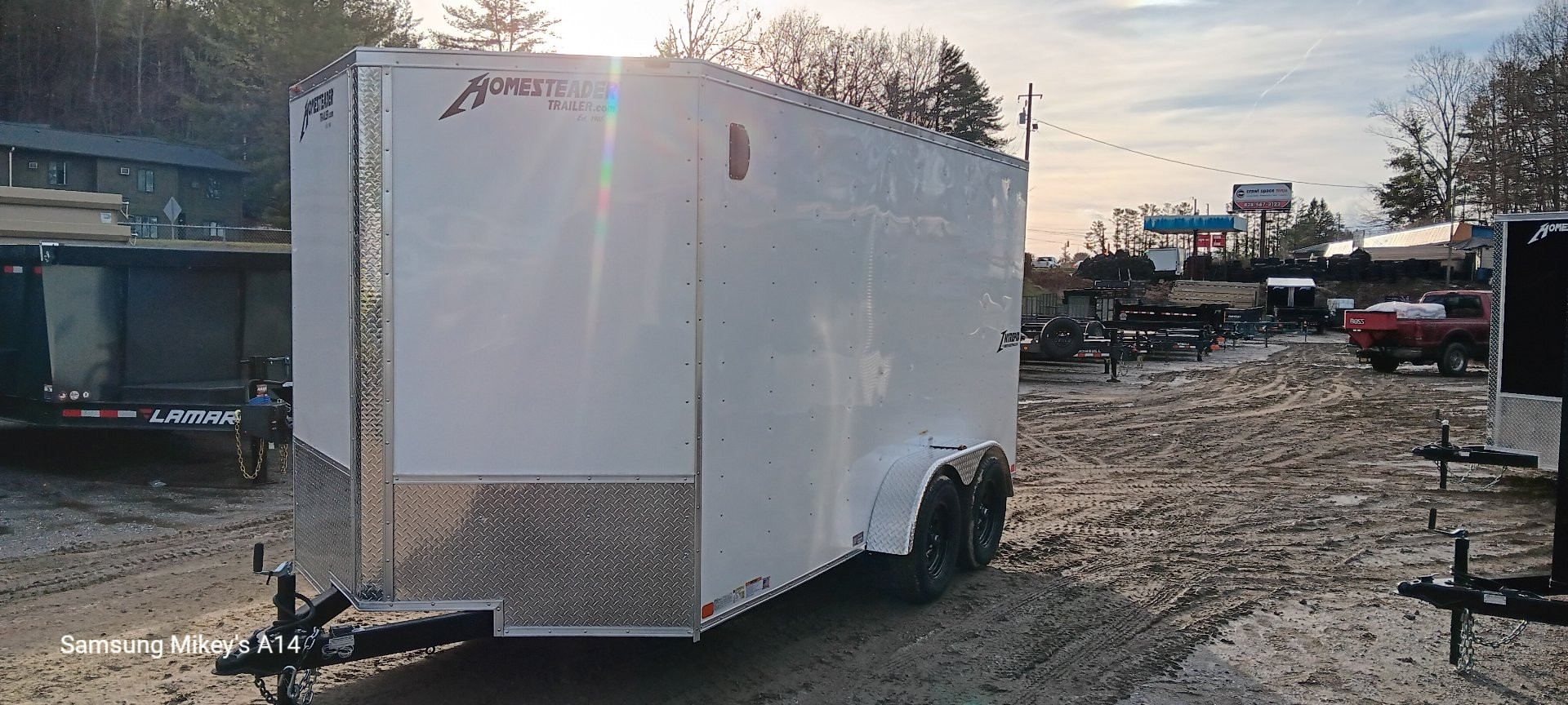 New 2025 Homesteader Trailers / 714IT Intrepid / 6'6" Interior Height / .030 White Aluminum / Ramp Rear Door / 32" Side Door