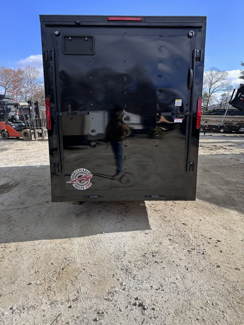 New 2025 HOMESTEADER TRAILER / INTREPID SERIES / 6' WIDE X 12' LONG / 6'6" INTERIOR HEIGHT / BLACK .030 ALUMINUM W/ BLACK OUT PKG / 32" SIDE DOOR W/ RV LOCK / RAMP REAR DOOR / 4-D RINGS / 16" O/C WALL POST