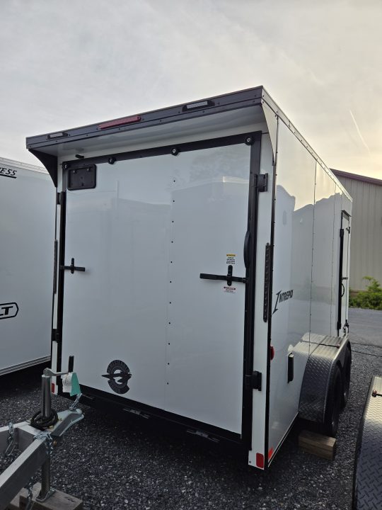 New 7 x 14 Homesteader Intrepid V-Nose Cargo 7k GVWR **White w/ BlackOut Pkg, 6" Extra Height & Ramp Door Package, Rear Spoiler w/ Lights