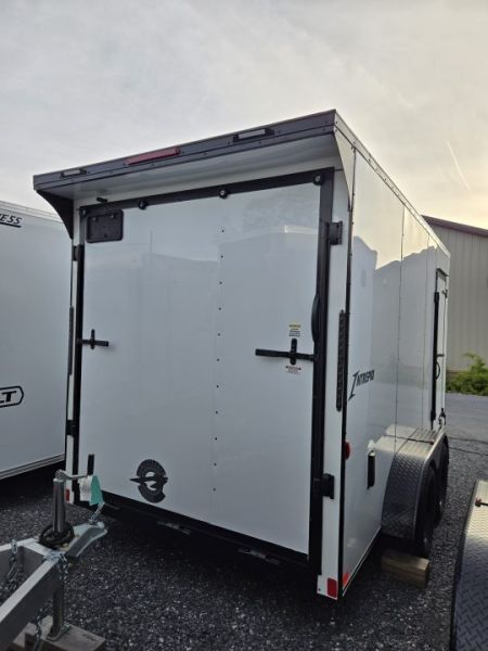 New 7 x 14 Homesteader Intrepid V-Nose Cargo 7k GVWR **White w/ BlackOut Pkg, 6" Extra Height & Ramp Door Package, Rear Spoiler w/ Lights