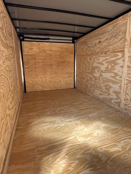 New 2026 7X16 QUALITY CARGO TANDEM AXLE ENCLOSED TRAILER WITH REAR SPOILER AND BLACKOUT PACKAGE